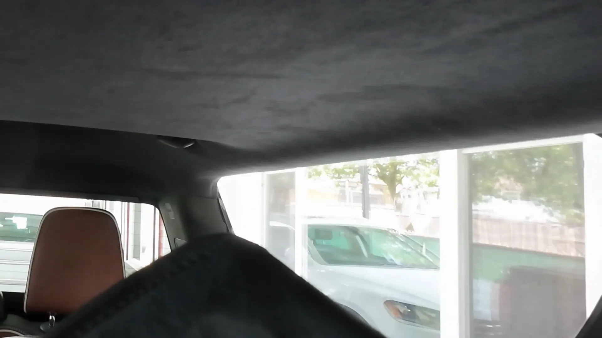 Tucking rear camera cable behind headliner and reassembling C-pillar
