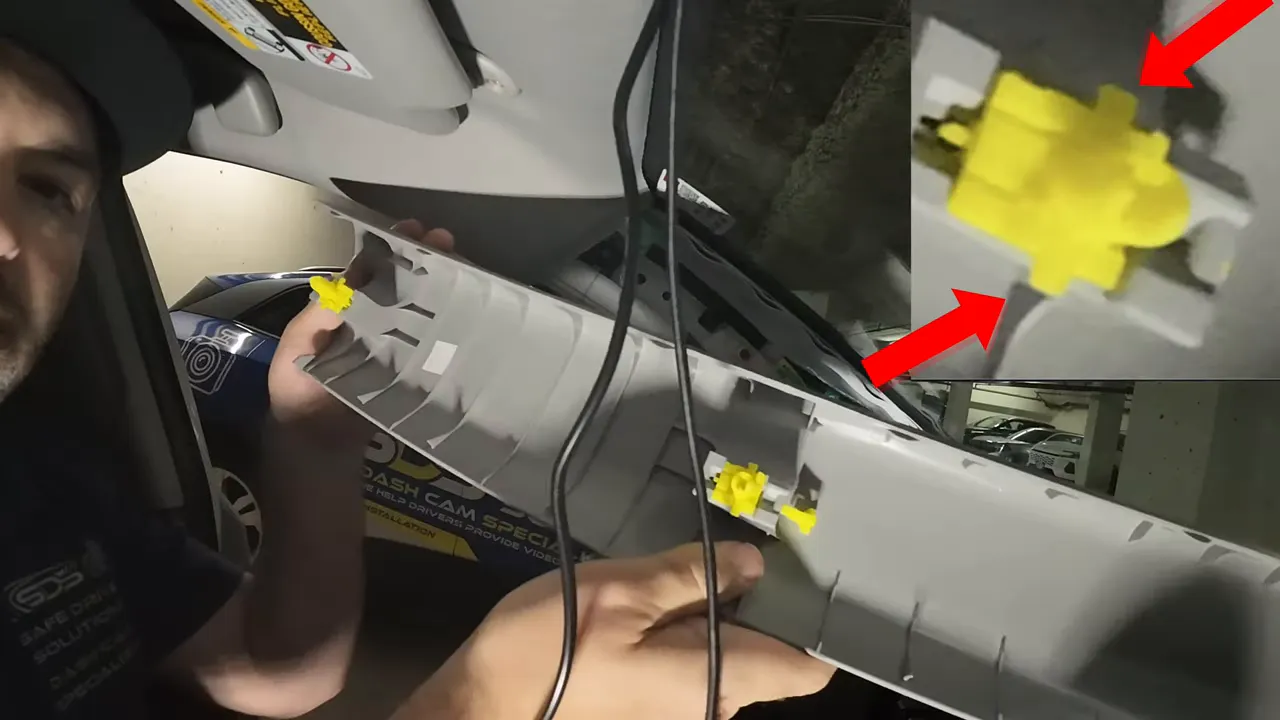 A pillar trim removed with yellow retaining clips visible and highlighted in an inset image