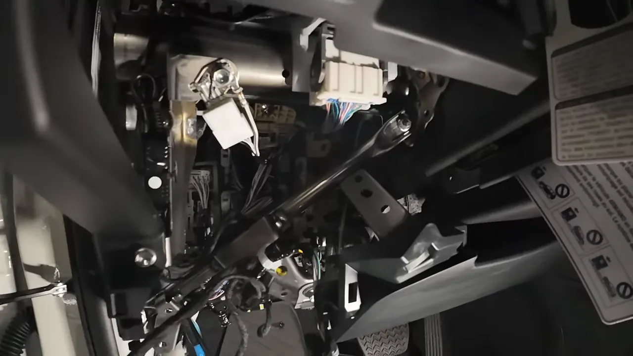 Lower dash area with added wiring routed along factory harness and secured under the dashboard