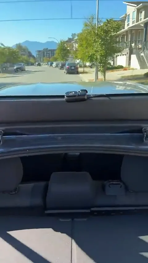 Rear camera mounted with hidden wiring routed through factory grommets