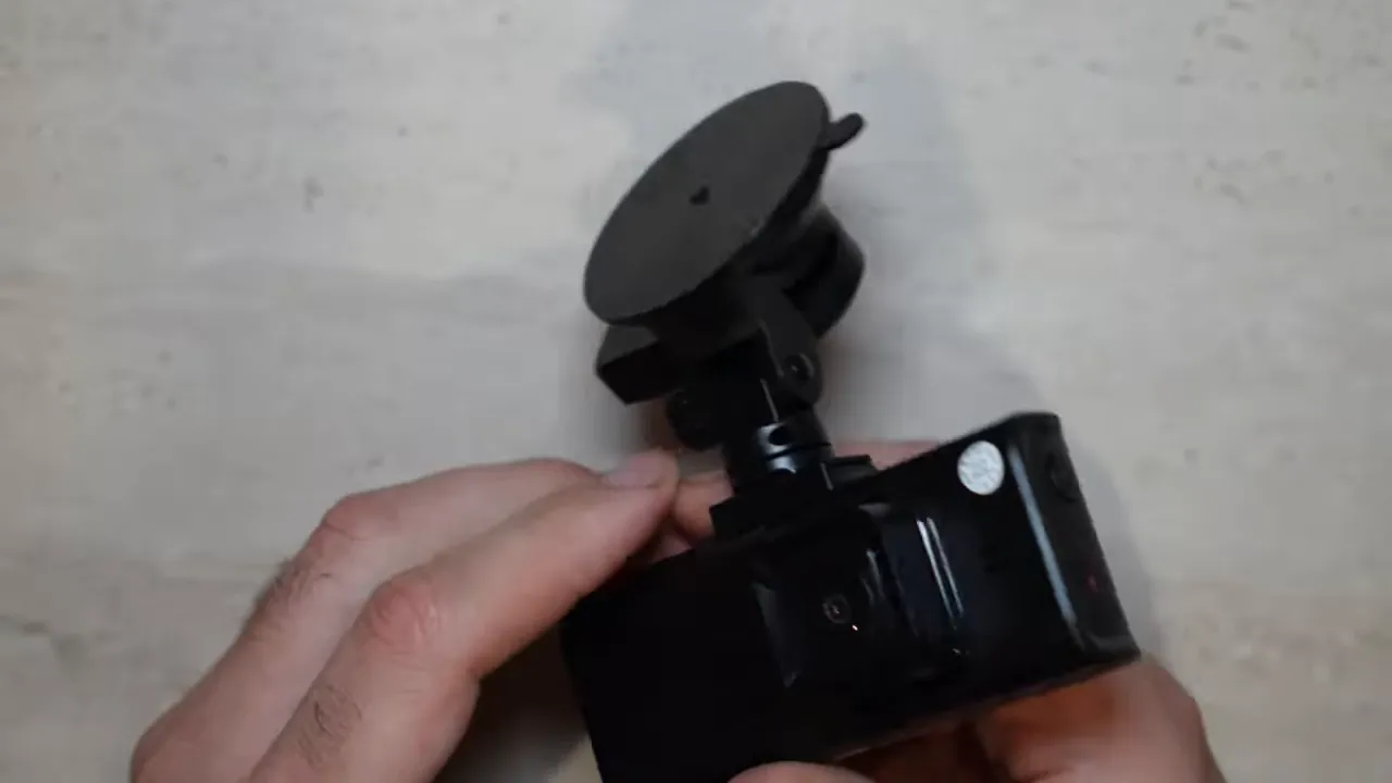 Red Tiger F7N Touch dash camera attached to a suction cup mount on a tabletop