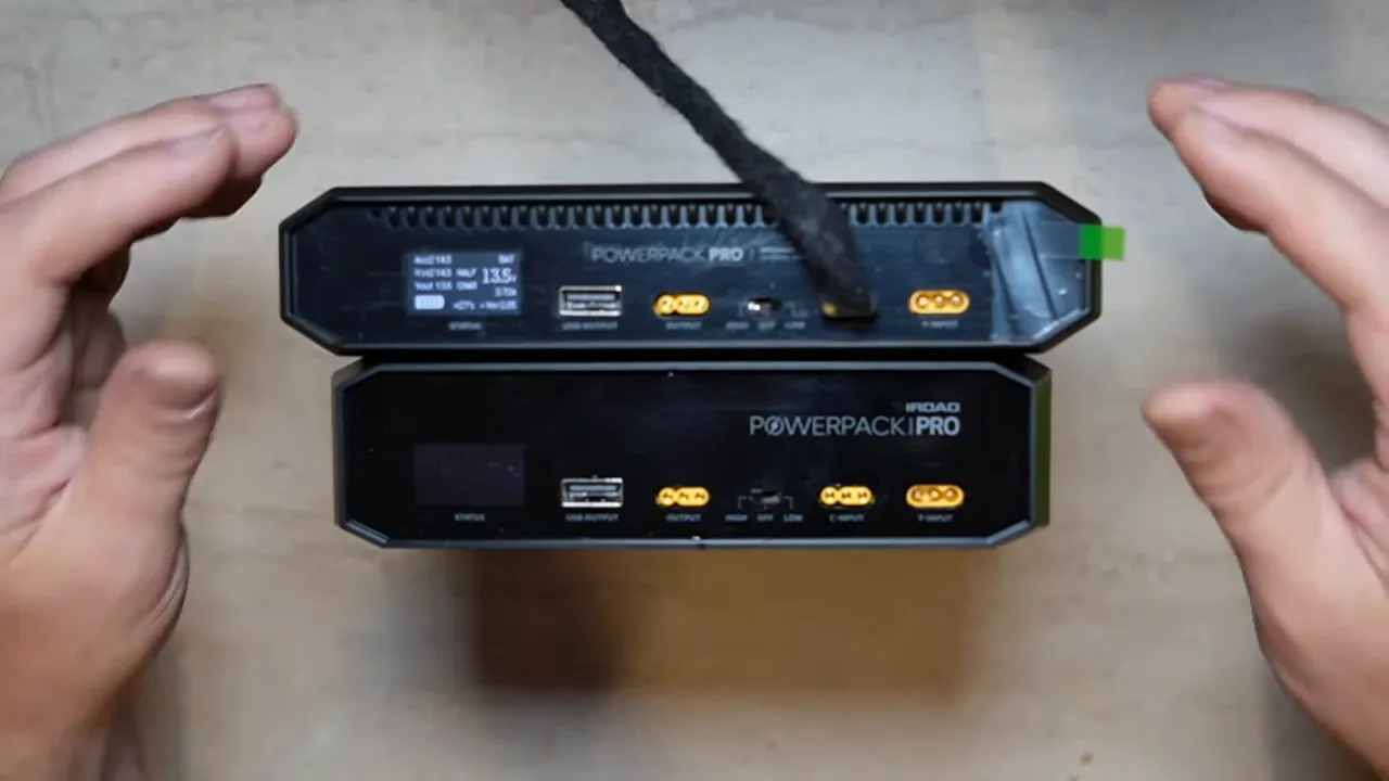 iRoad Powerpack Pro 15 battery pack front and back view showing LCD and charging ports