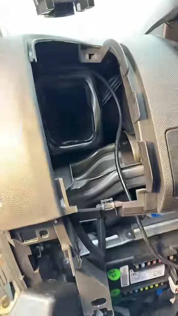 empty dash pocket with gps wiring routed behind trim showing a hidden installation location