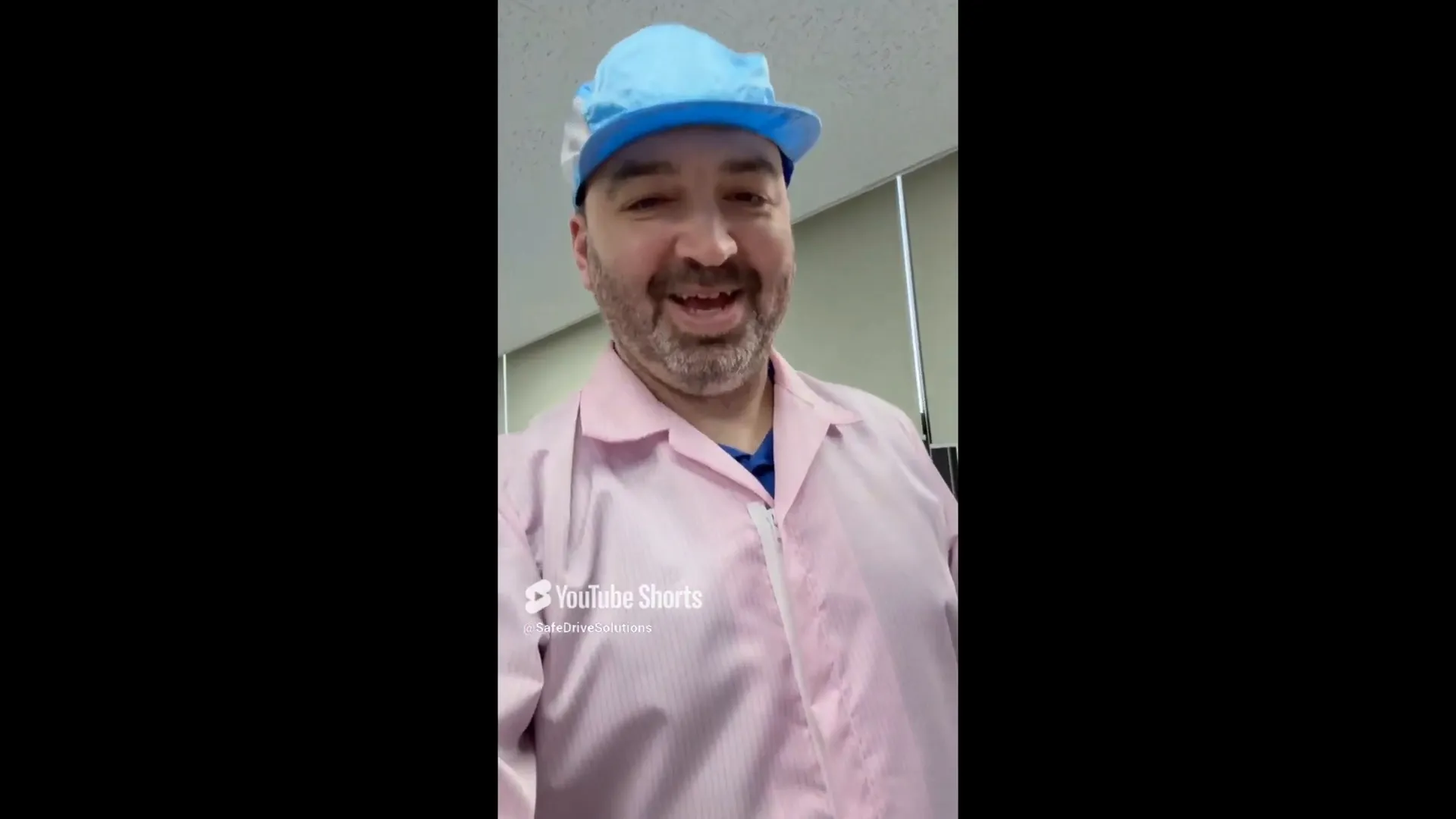 Entering the Thinkware facility in protective clothing