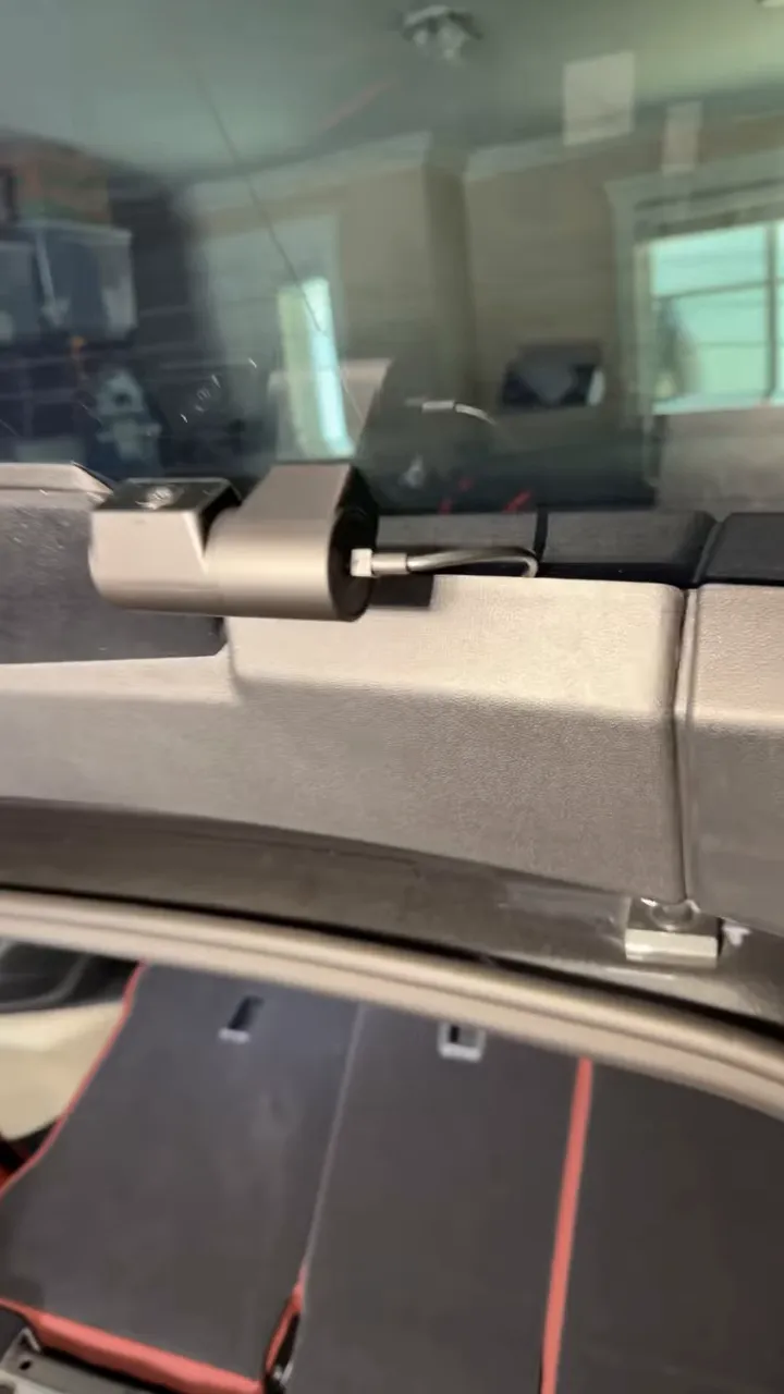 rear camera mounted on hatch glass with cable routed into trim