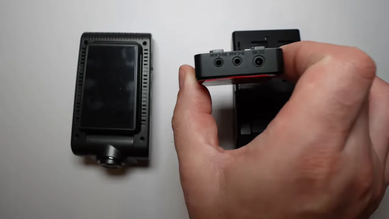 Detached S1 mounting assembly showing three connection ports above the camera body