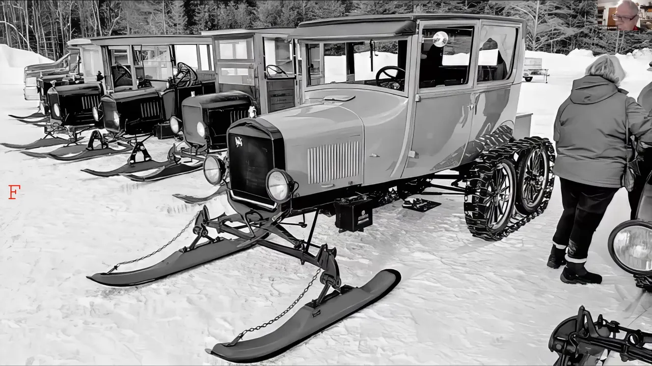 Row of early Model T snowmobile conversions with front skis and rear tracks in the snow