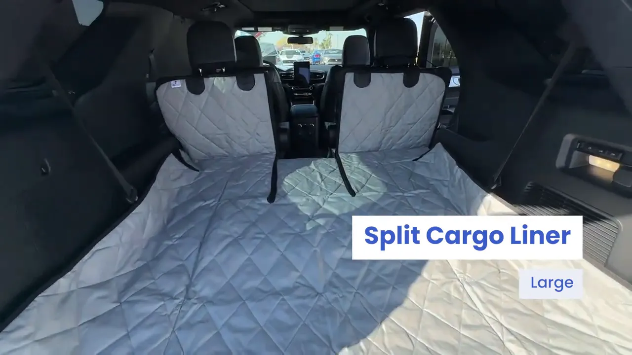 Gray quilted split cargo liner covering the Ford Explorer cargo floor and rear seatbacks