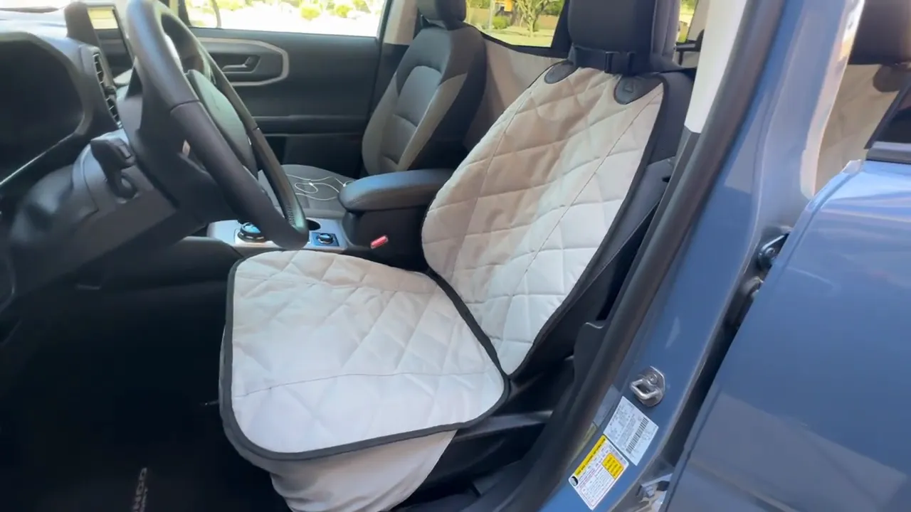 Quilted front seat cover installed on the front passenger seat of a Ford Bronco Sport