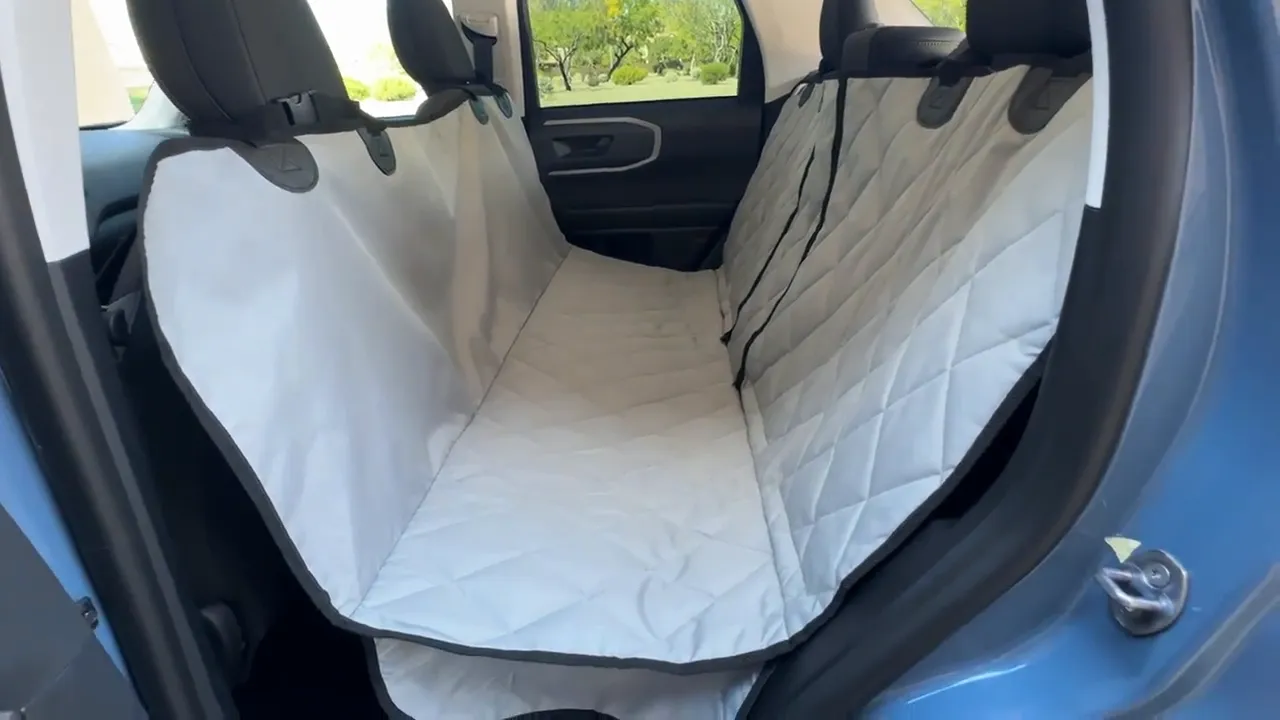 Quilted hammock-style rear seat cover installed across the rear bench of a Bronco Sport