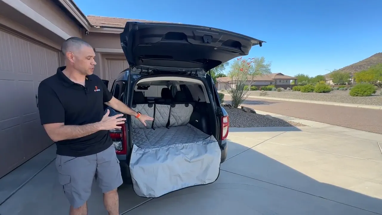 Open Bronco Sport cargo area with a quilted cargo liner covering the floor and bumper edge