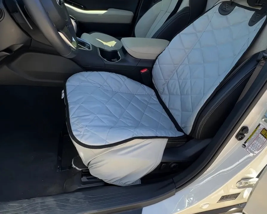 Gray quilted bucket seat cover installed on the Subaru Outback front driver seat