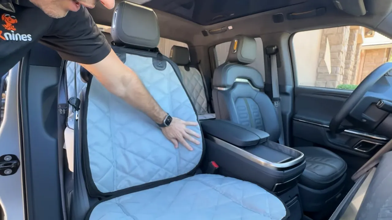 Gray quilted bucket seat cover fitted over the Rivian R1T front passenger seat