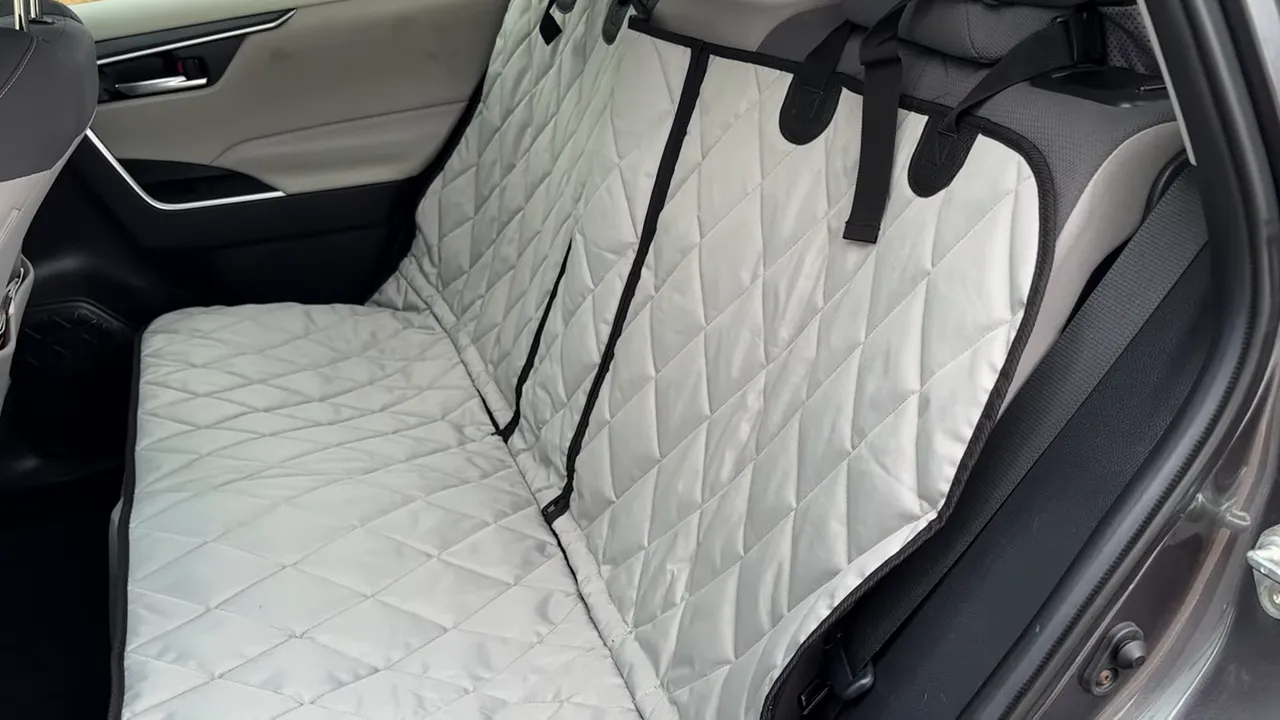 Gray quilted fitted rear seat cover installed across the Toyota RAV4 rear bench