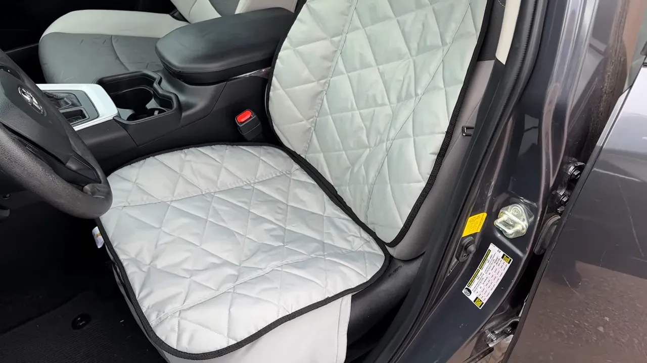 Gray quilted bucket seat cover installed on the Toyota RAV4 front driver seat