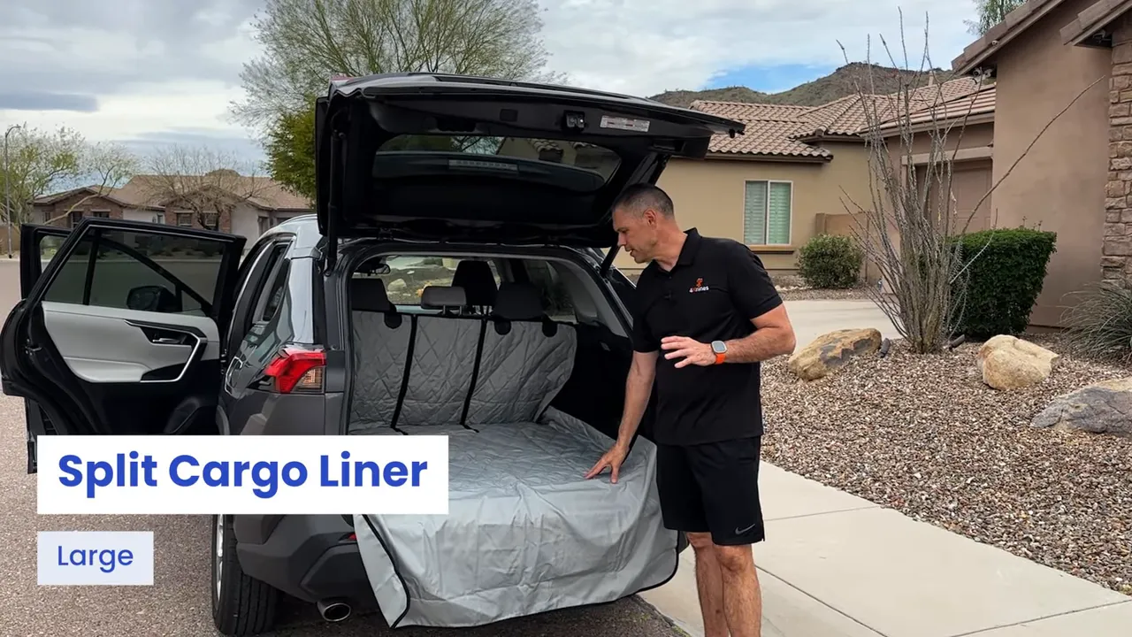 Open Toyota RAV4 cargo area covered by a gray split cargo liner