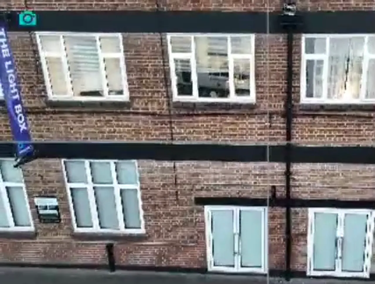 brick building facade with aligned windows demonstrating consistent framing for photogrammetry