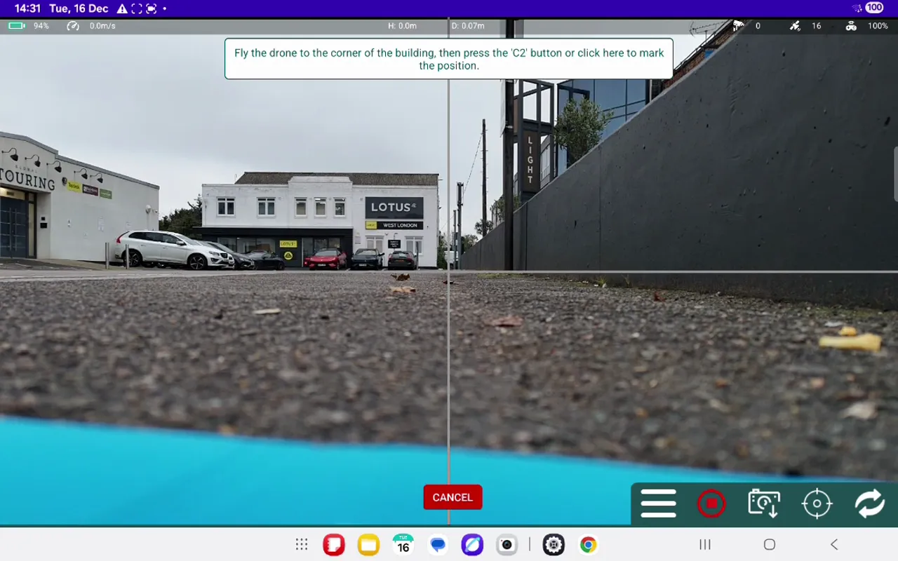 Ground-level camera view with crosshairs and instruction to press the 'C2' button to mark the building corner