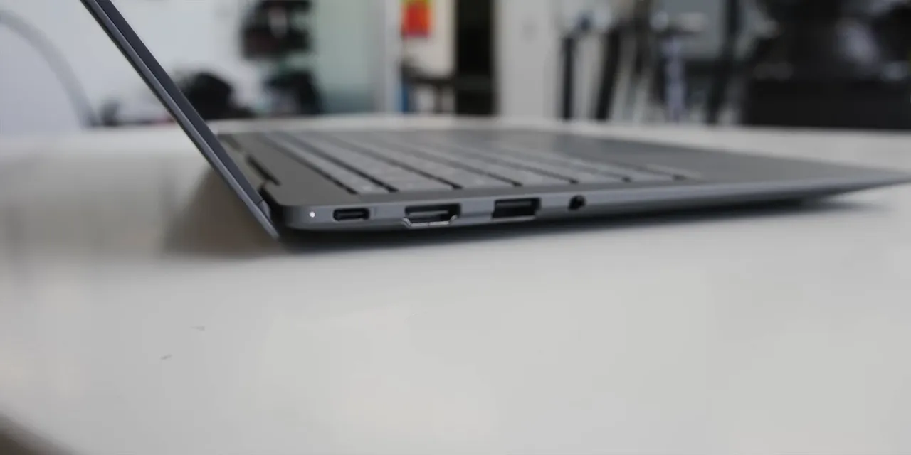 Side view of the thin ASUS laptop showing its ports