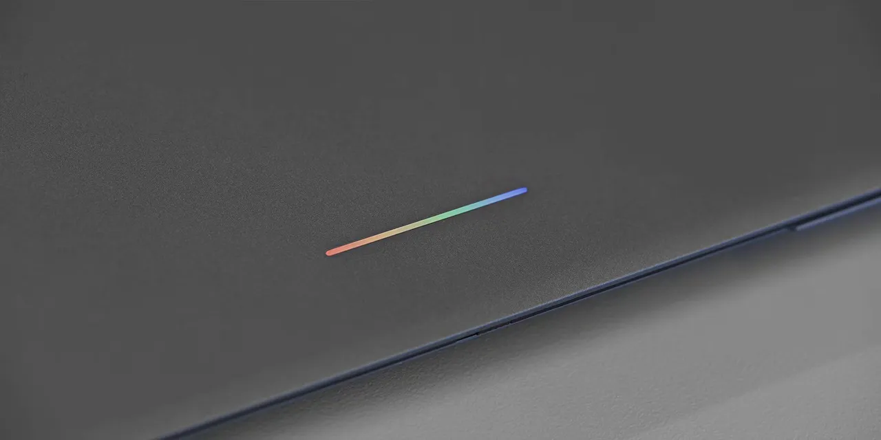 Close-up of a multicolored light bar on a gray laptop lid