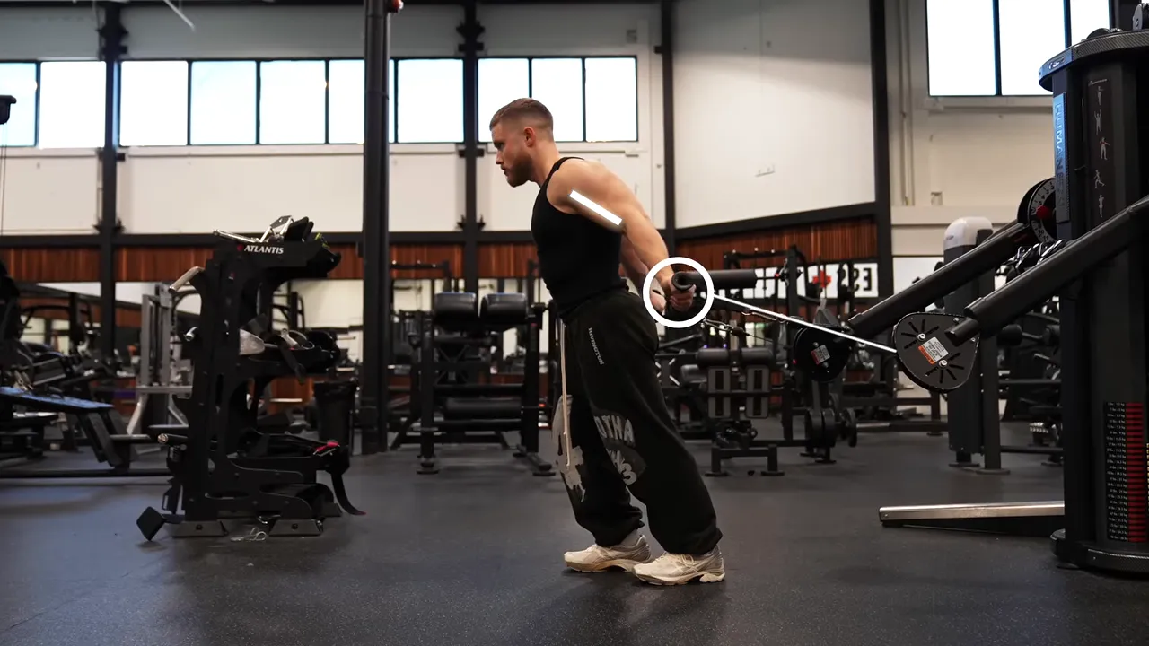 Side view of a face-away cable curl with the arms extended behind the torso and cables running backward