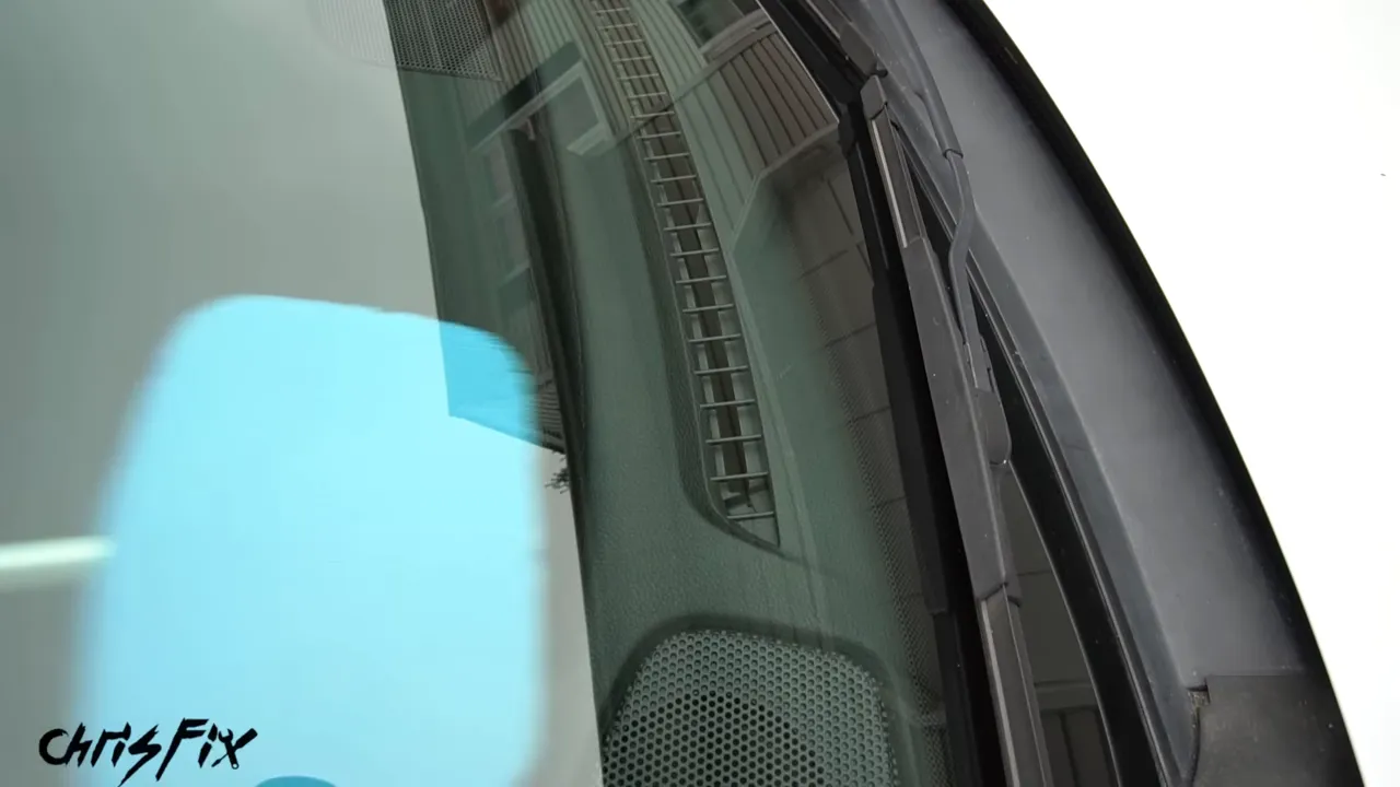 Handled microfiber cleaning pad reaching the lower windshield above the dashboard