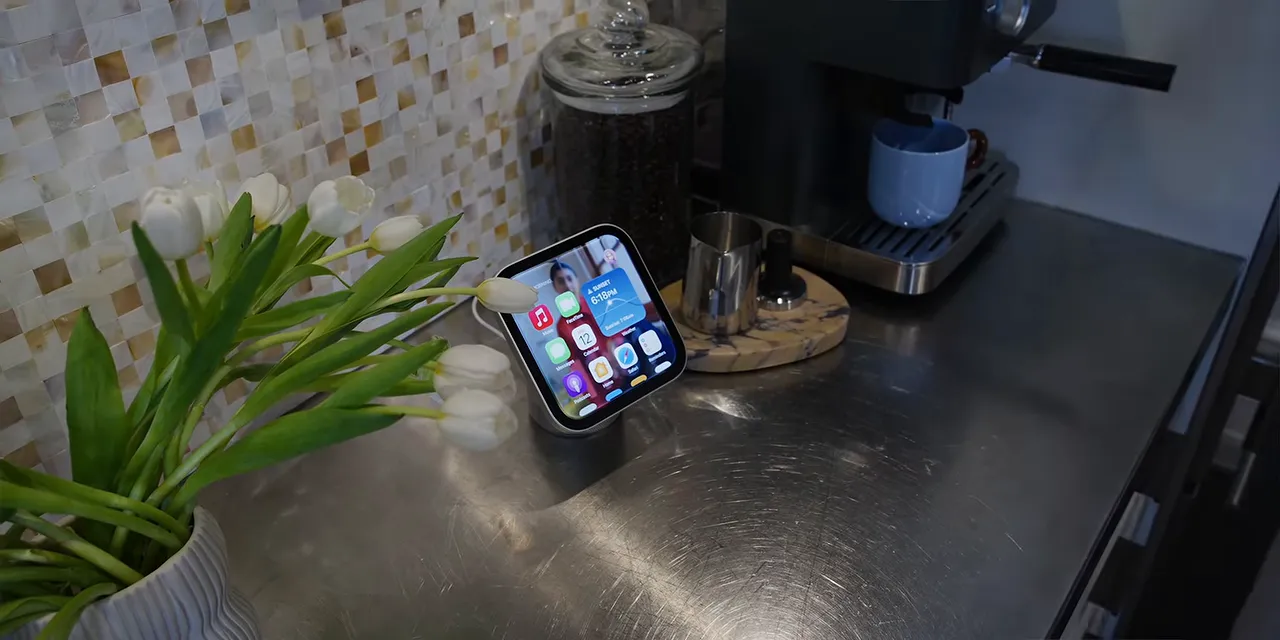 HomeView on a kitchen counter displaying a grid of app icons and widgets