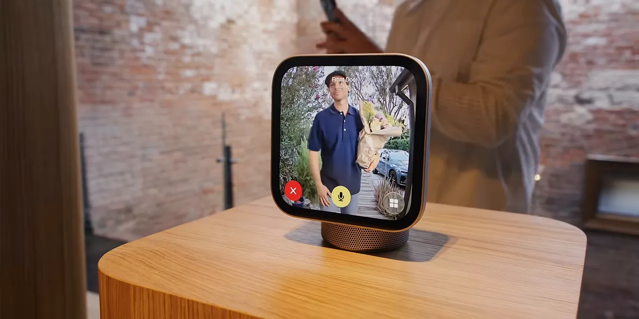 HomeView on a wooden pedestal showing a video call with call controls along the bottom