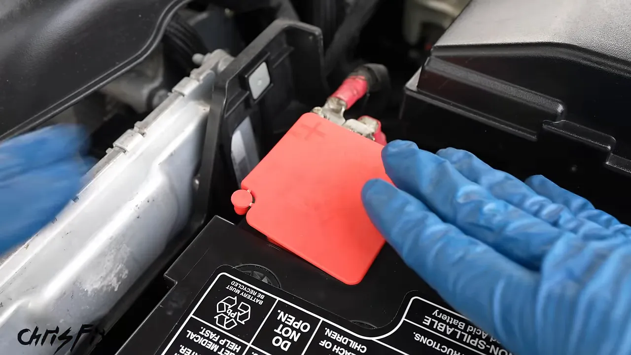 Red protective cover installed over the positive battery terminal