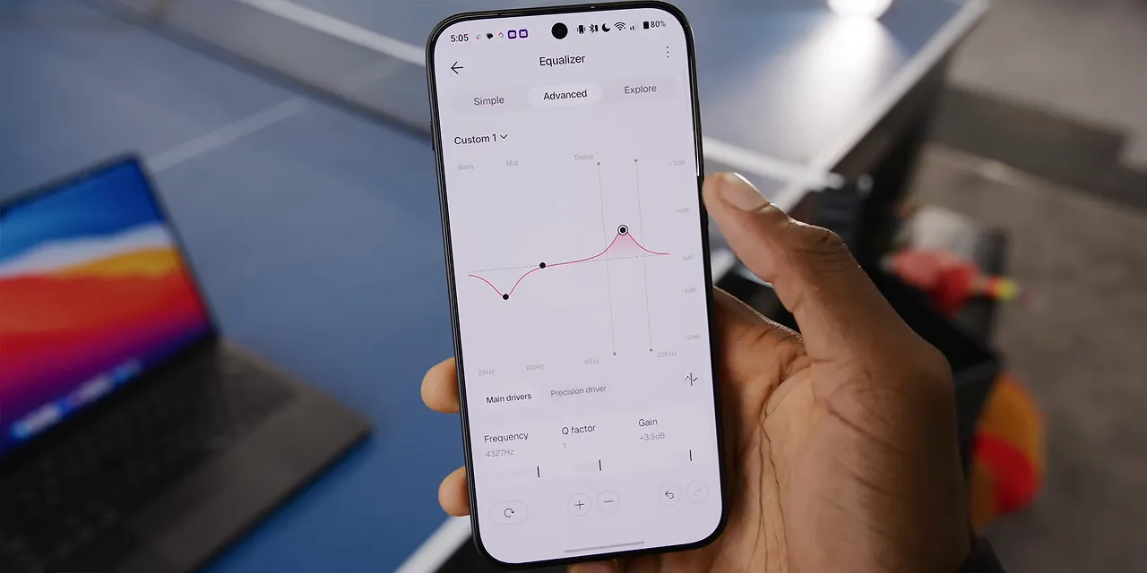 Phone displaying the Nothing app equalizer with a frequency curve and adjustable points
