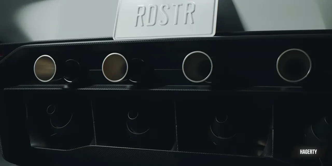 Roadster rear panel with four round upper outlets and four lower fan openings