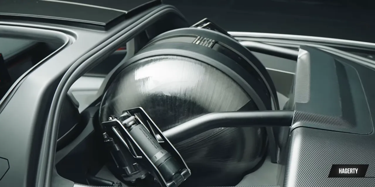 Large rounded carbon-fiber pressure vessel installed behind the Roadster cabin