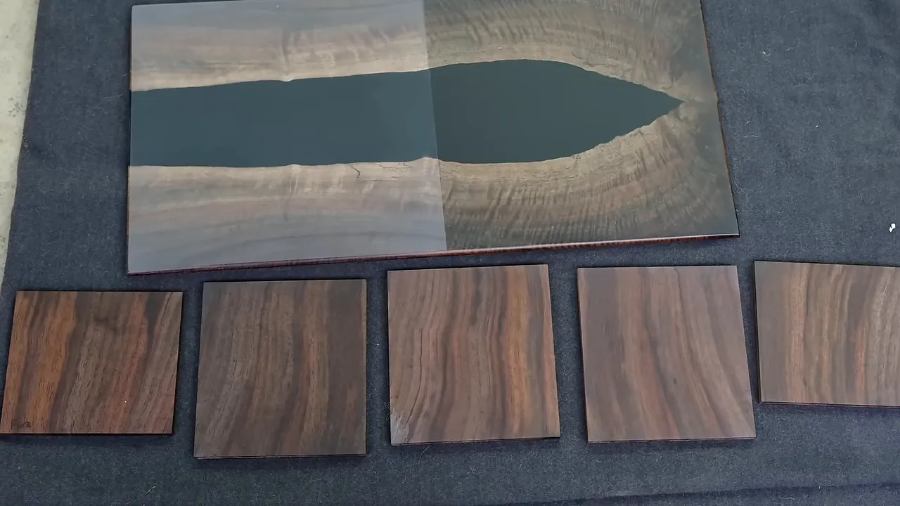 Wood finish samples arranged below a wood and epoxy serving board