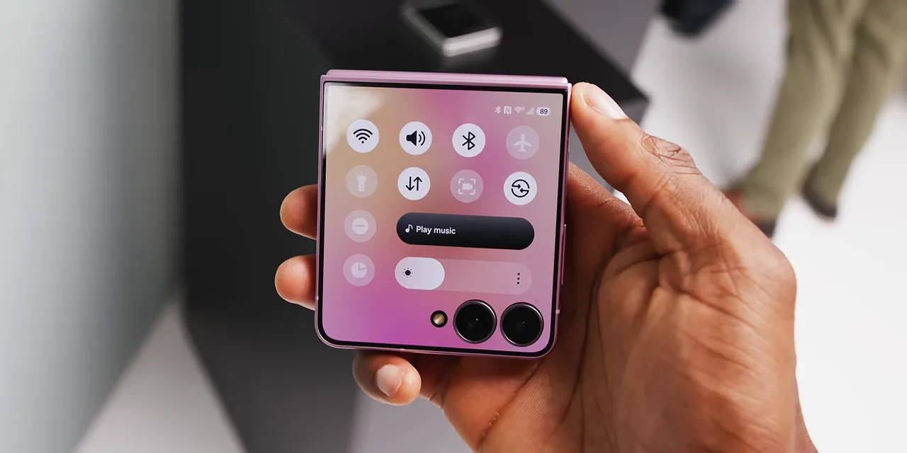 Galaxy Z Flip 8 held closed with quick settings displayed on its cover screen