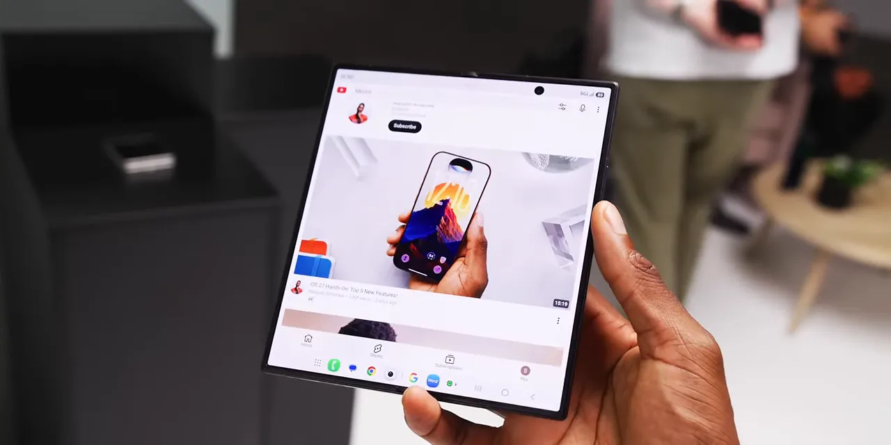 Galaxy Z Fold 8 Ultra held open with its home screen displayed across the inner screen