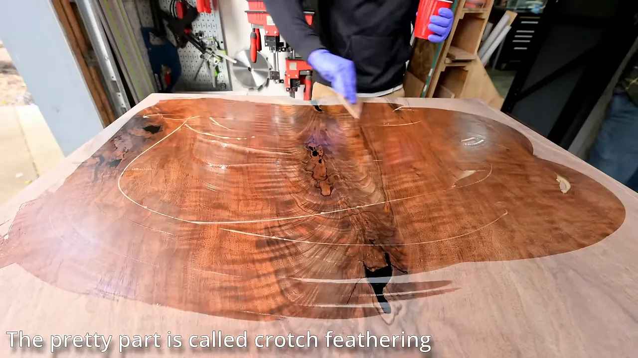 Fresh finish revealing dark feathered grain and bow tie inlays in the walnut top