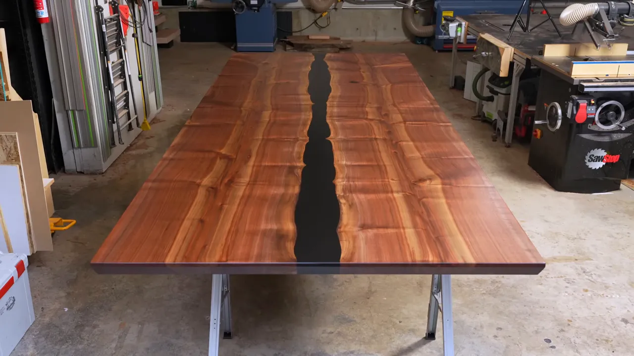Finished rectangular wood dining tabletop with a black epoxy river running down the center