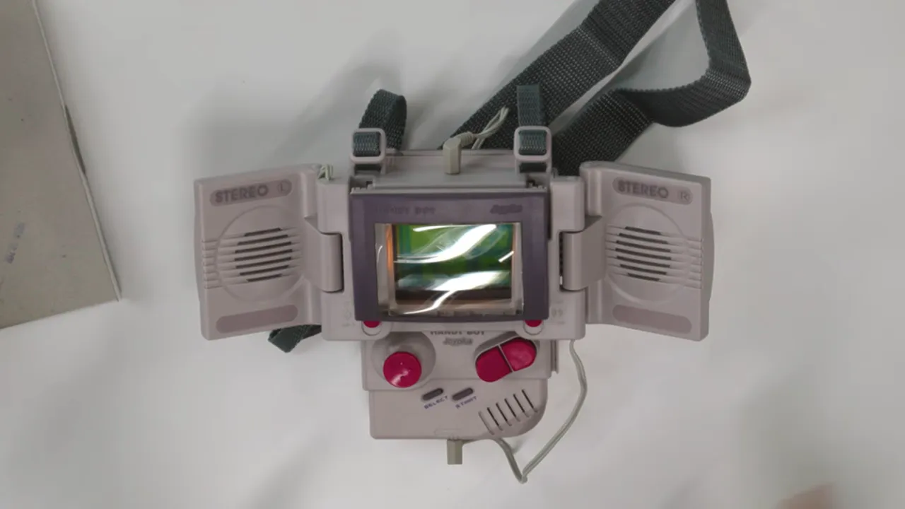 Game Boy fitted with a Handy Boy magnifier, side speakers, and extended controls