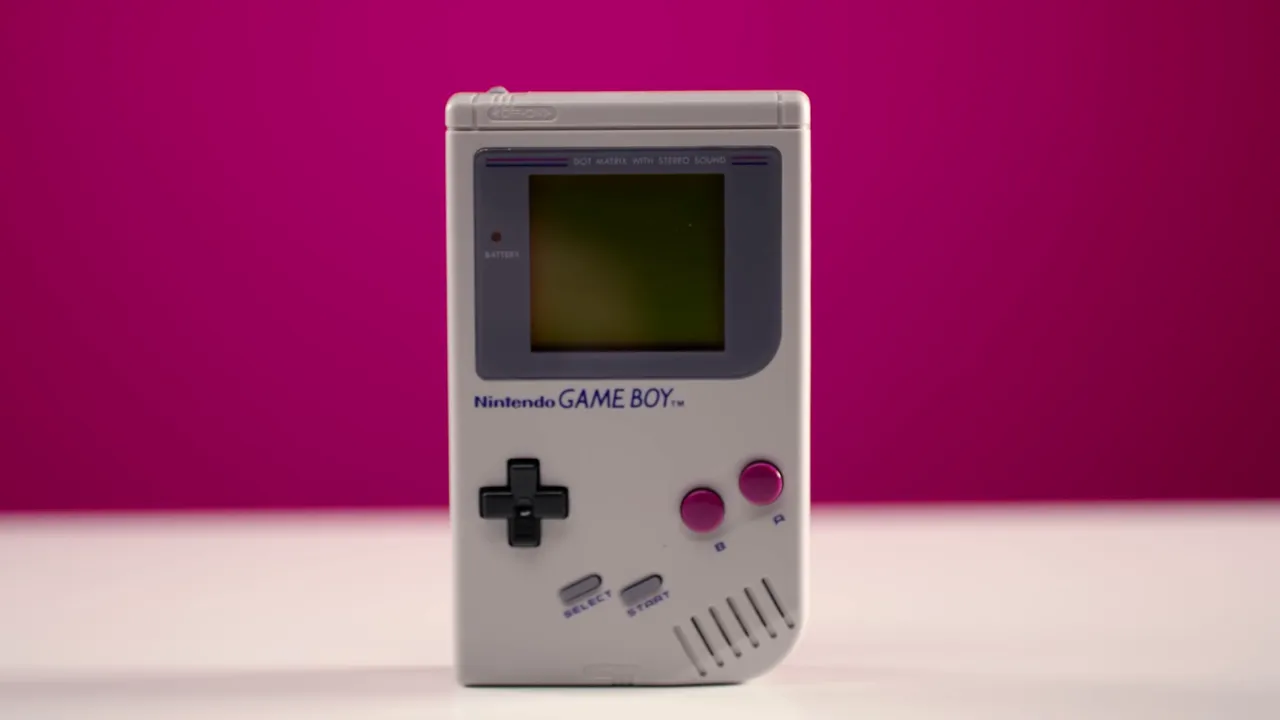 Original gray Nintendo Game Boy with a black D-pad and magenta buttons