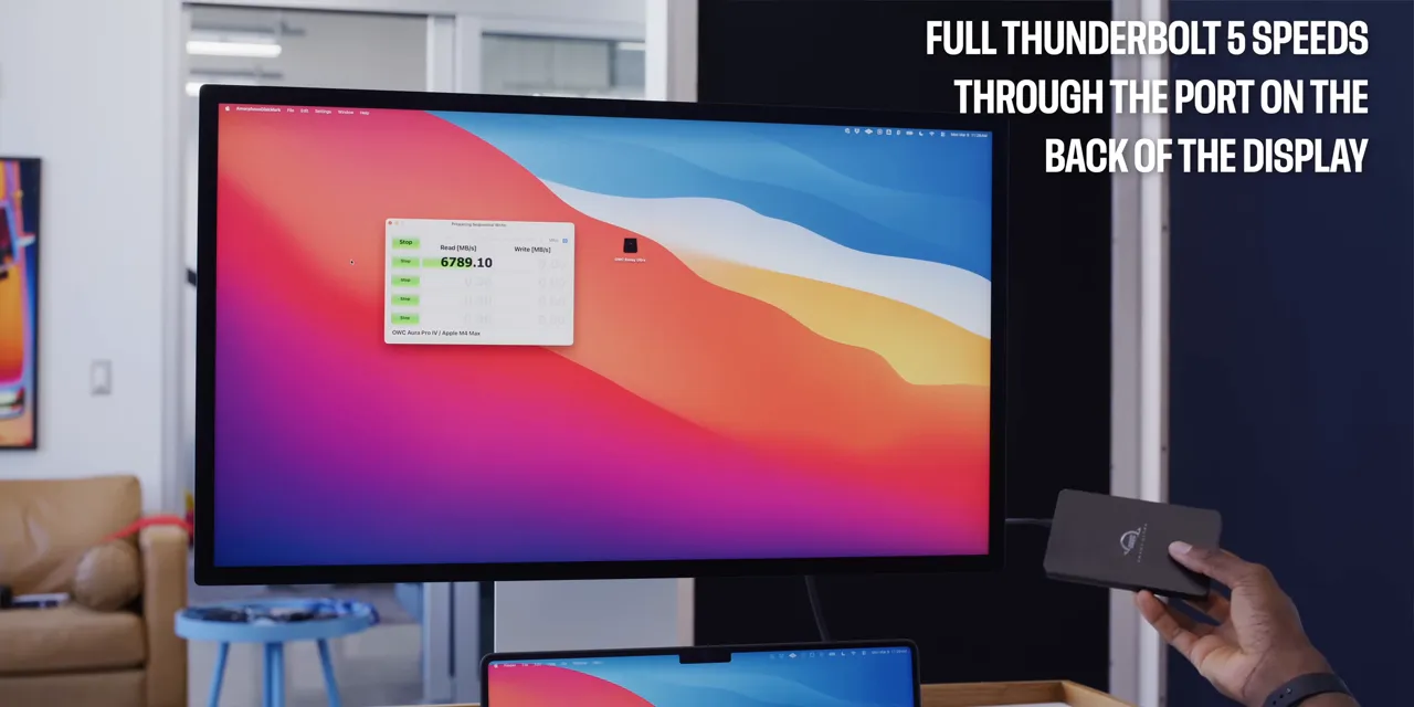 Monitor and external drive with on-screen text stating full Thunderbolt 5 speeds through the rear display port