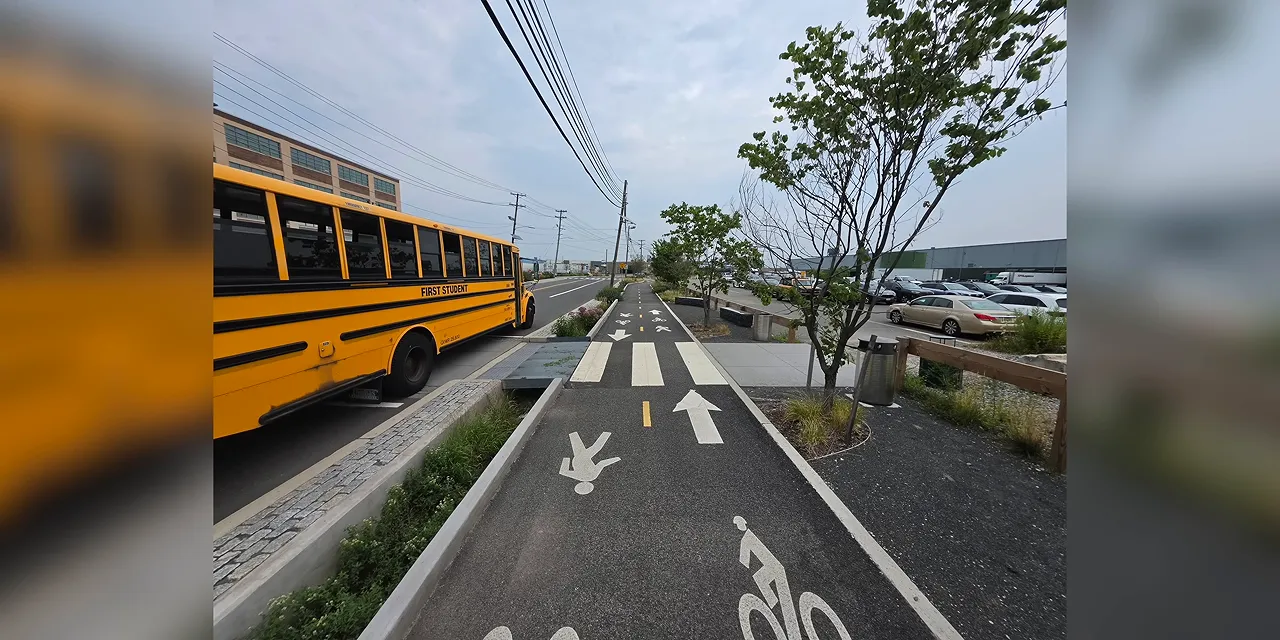 Sample photo of a yellow school bus beside a marked bicycle path