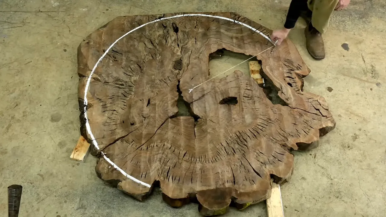 Overhead view of a cracked walnut cookie with a white circle marked around its perimeter