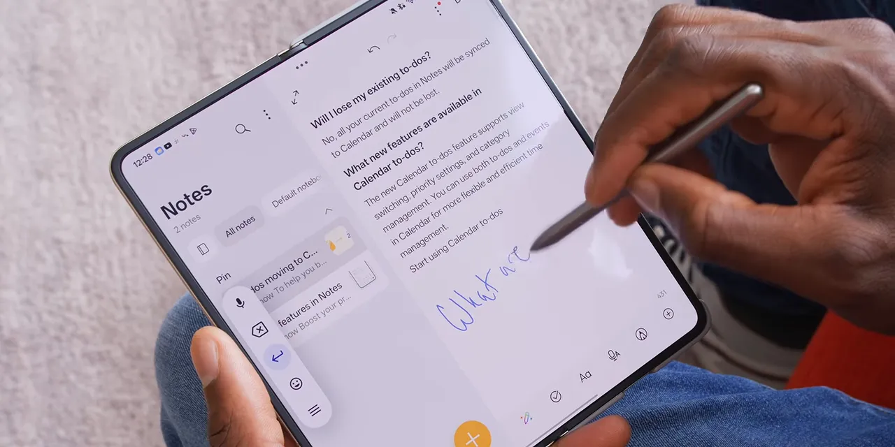 A stylus writing handwritten notes on the unfolded Oppo Find N6