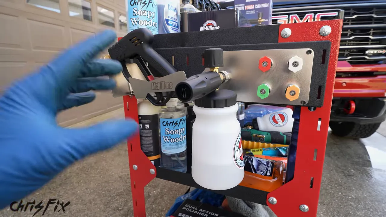 Stainless steel holder mounted to a detailing cart with a sprayer, foam cannon, and colored nozzles