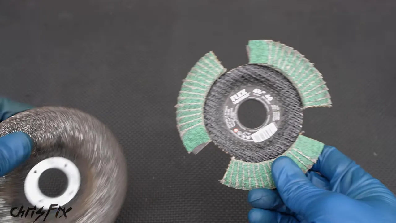 Conventional abrasive disc beside a green disc with three large cutouts
