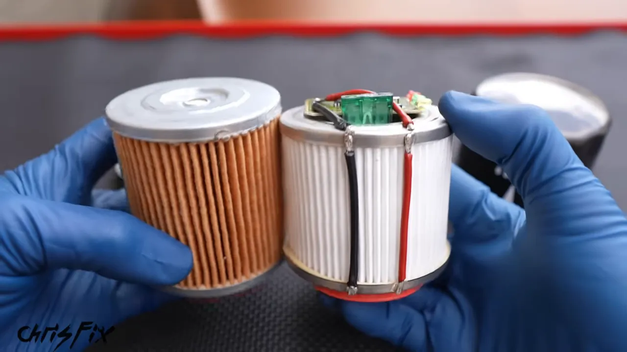 Two cut-open oil filter elements, one with a metal end plate and one with a circuit board and wires