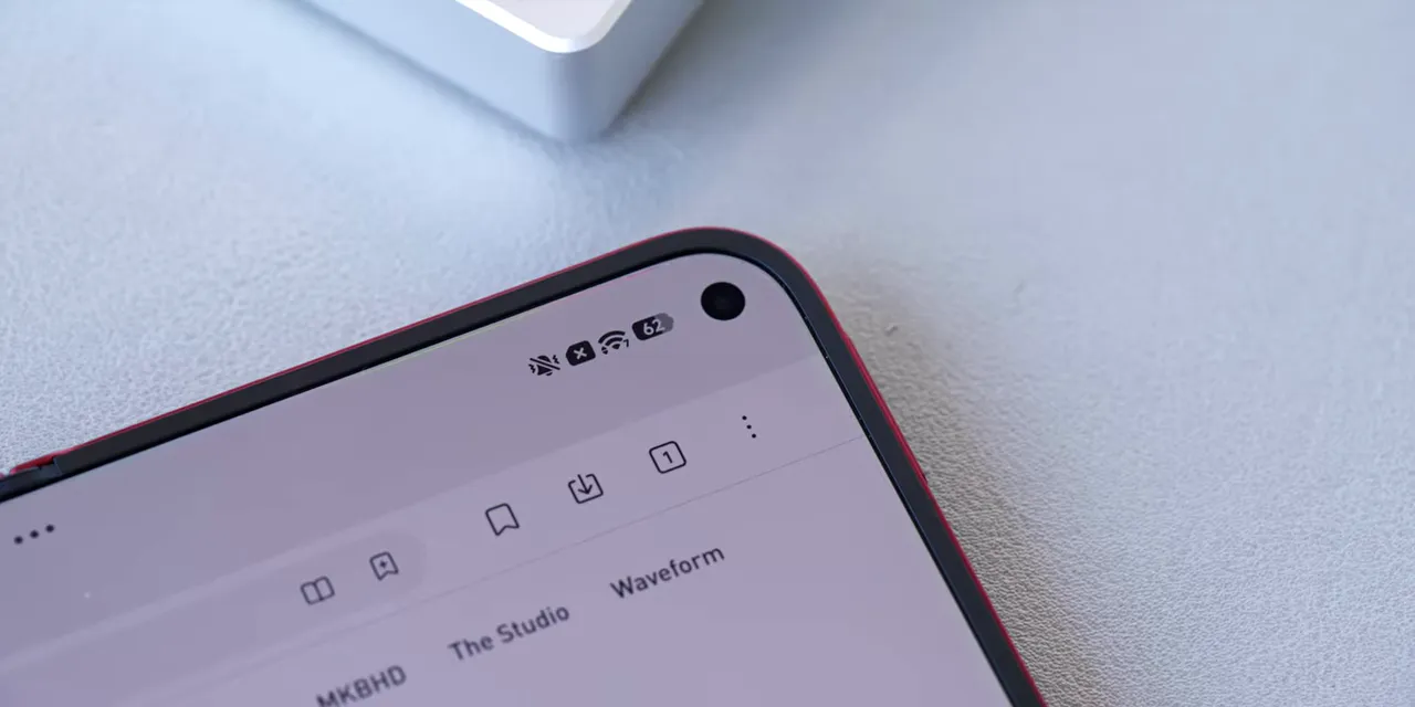 Close-up of the Xiaomi inner display corner showing a circular camera cutout