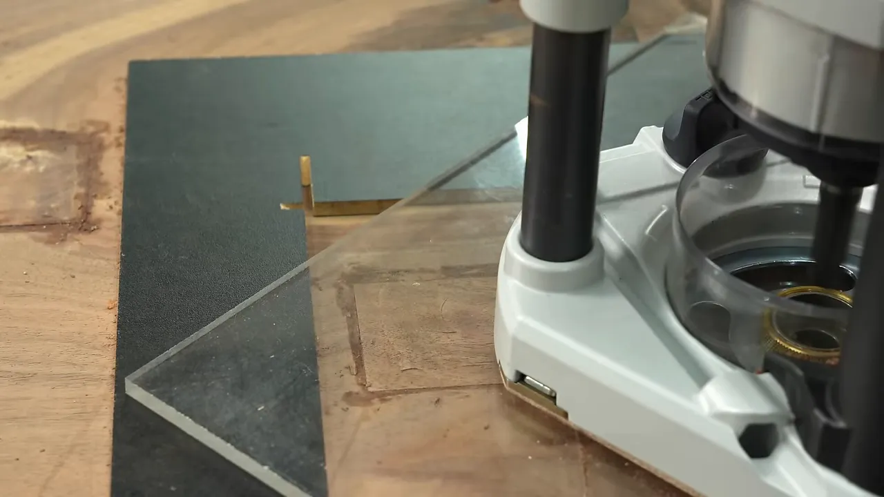 Flat rectangular frame surrounding a group of overlapping walnut patches after router flattening