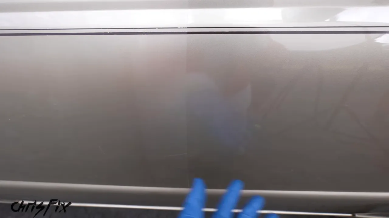 Pickup door showing a dull scratched section beside a glossier corrected section