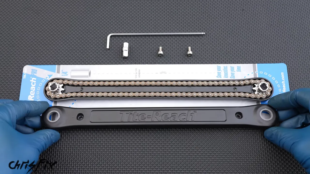 Opened ratchet extender showing a chain running between sprockets at both ends